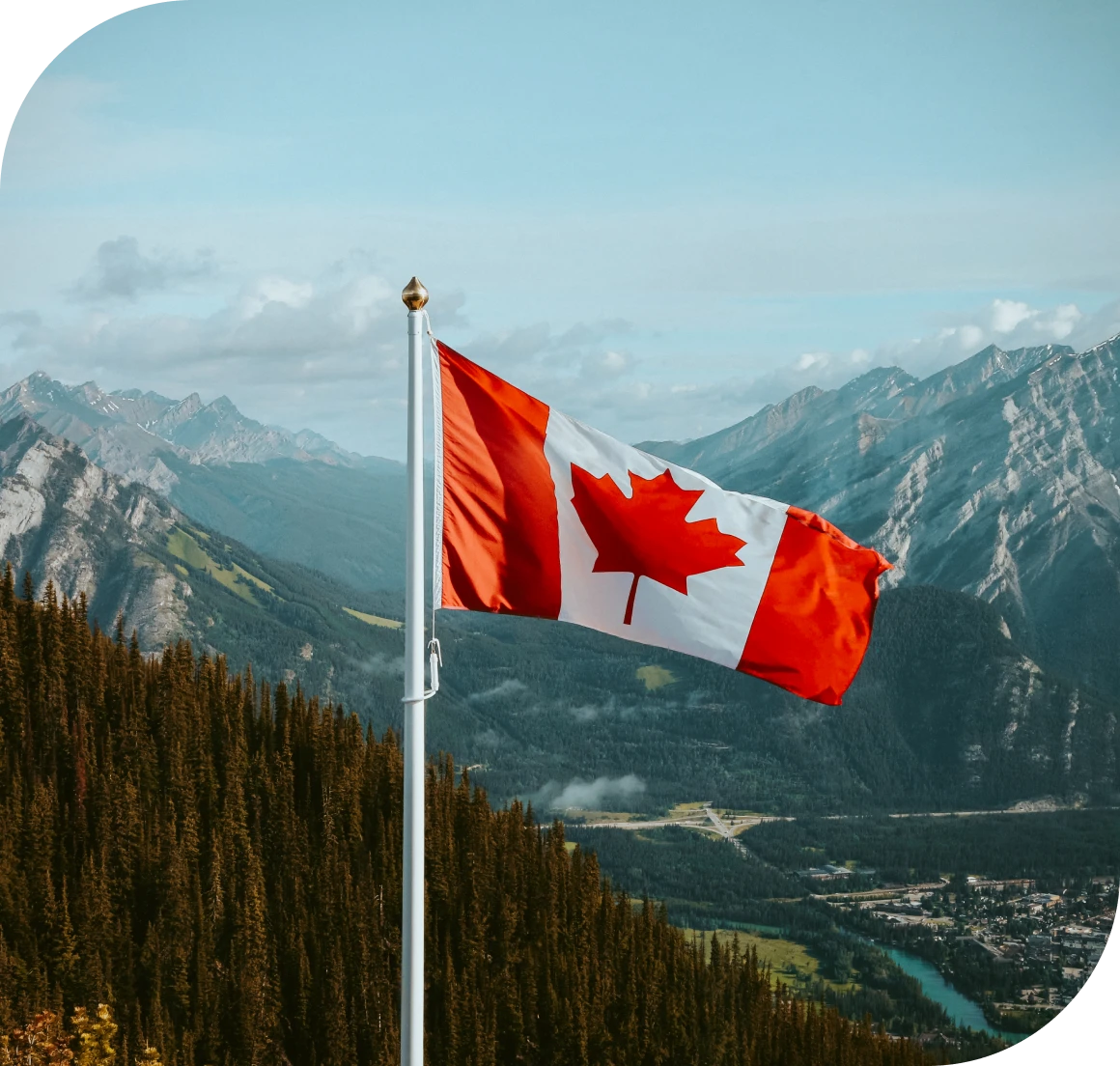 National flag above forested mountains
