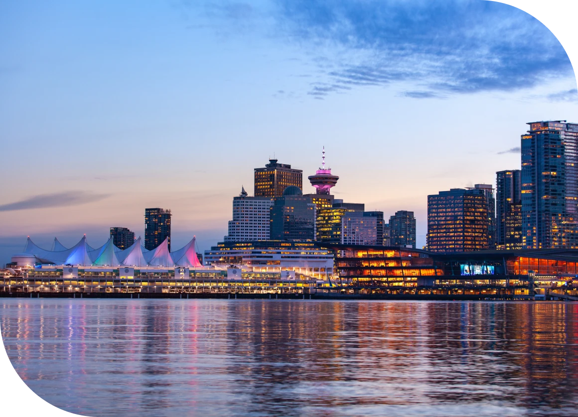 City skyline at dusk, reflecting water