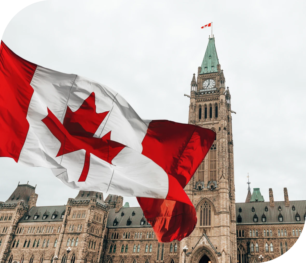 Parliament Hill with Canadian flag