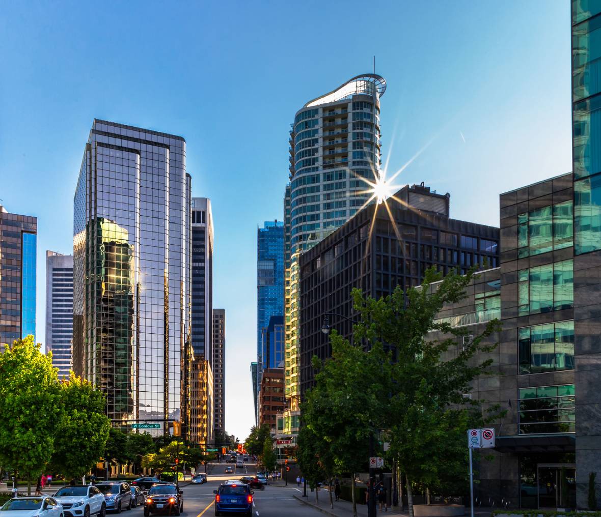Downtown glass towers with sunburst