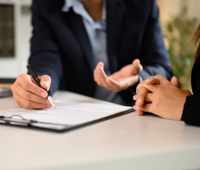 Hands gesturing over a document