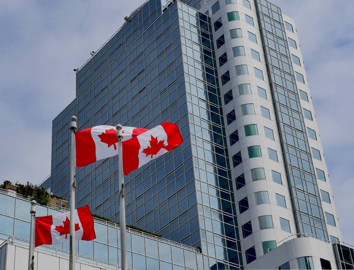 High-rise building with Canadian flags