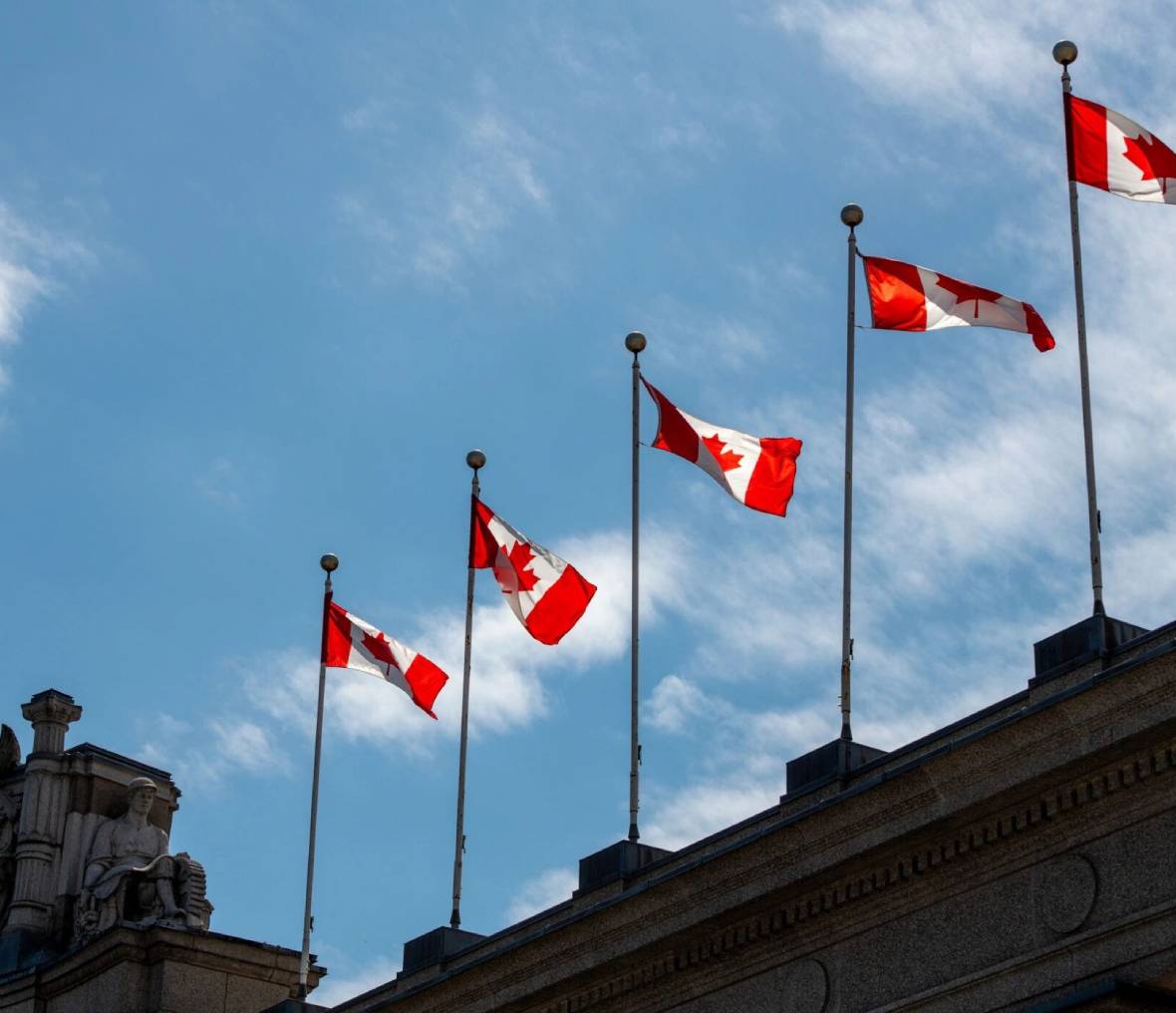 Row of Canadian flags on poles
